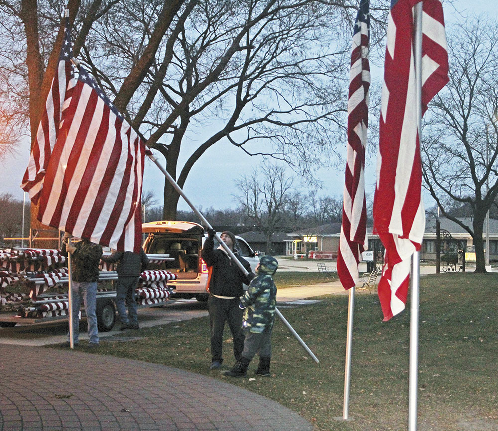 Lions raise flags on Veterans Day Charles City Press