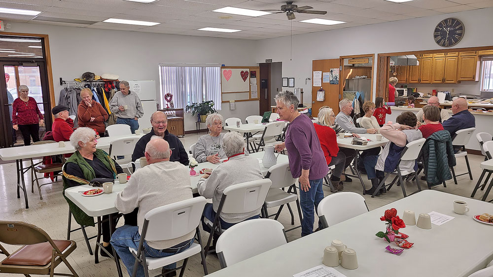 Community Center serves coffee and rolls to entice new members